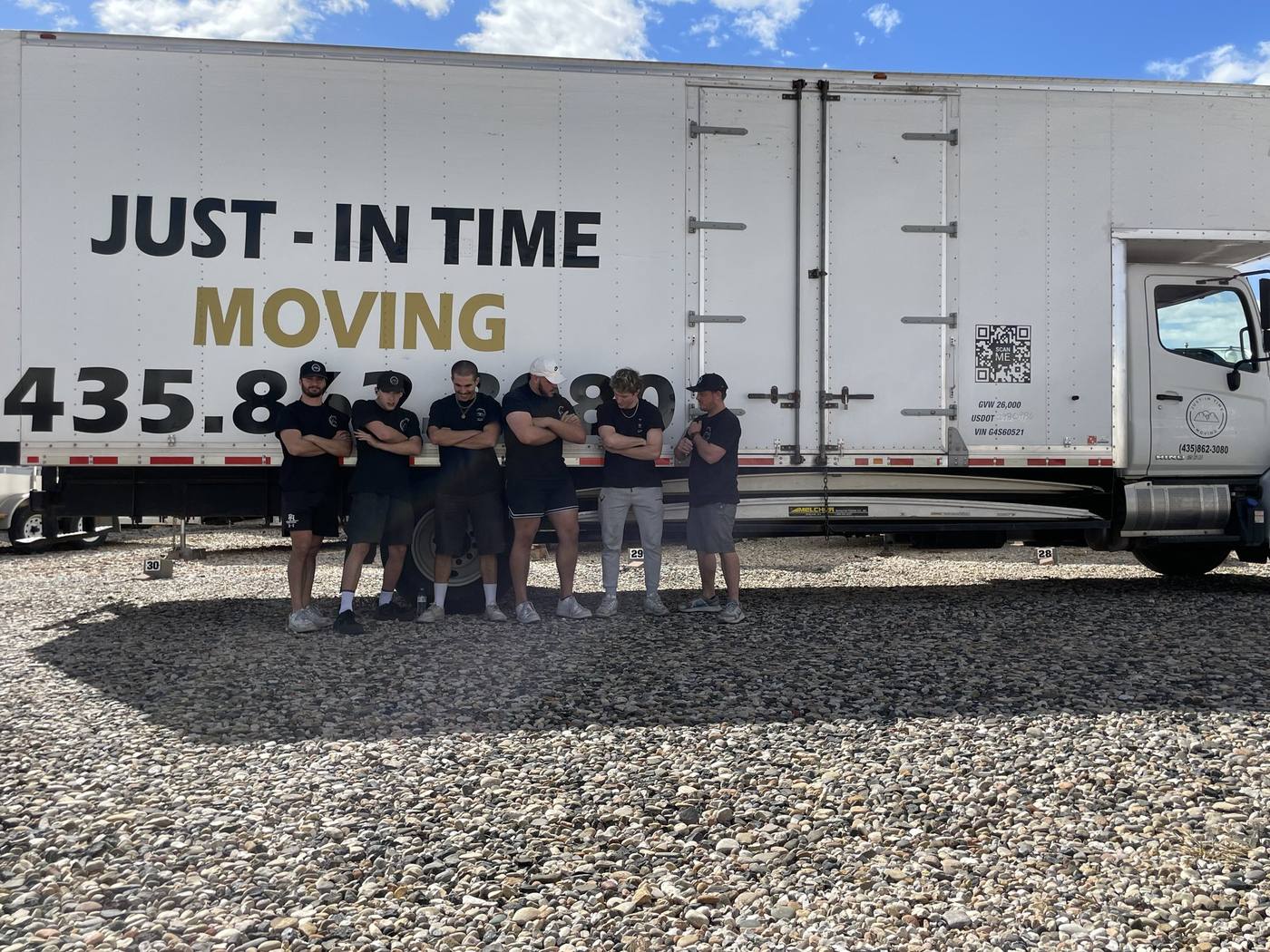 The Just-In-Time Moving crew in front of a company truck in St. George, Utah